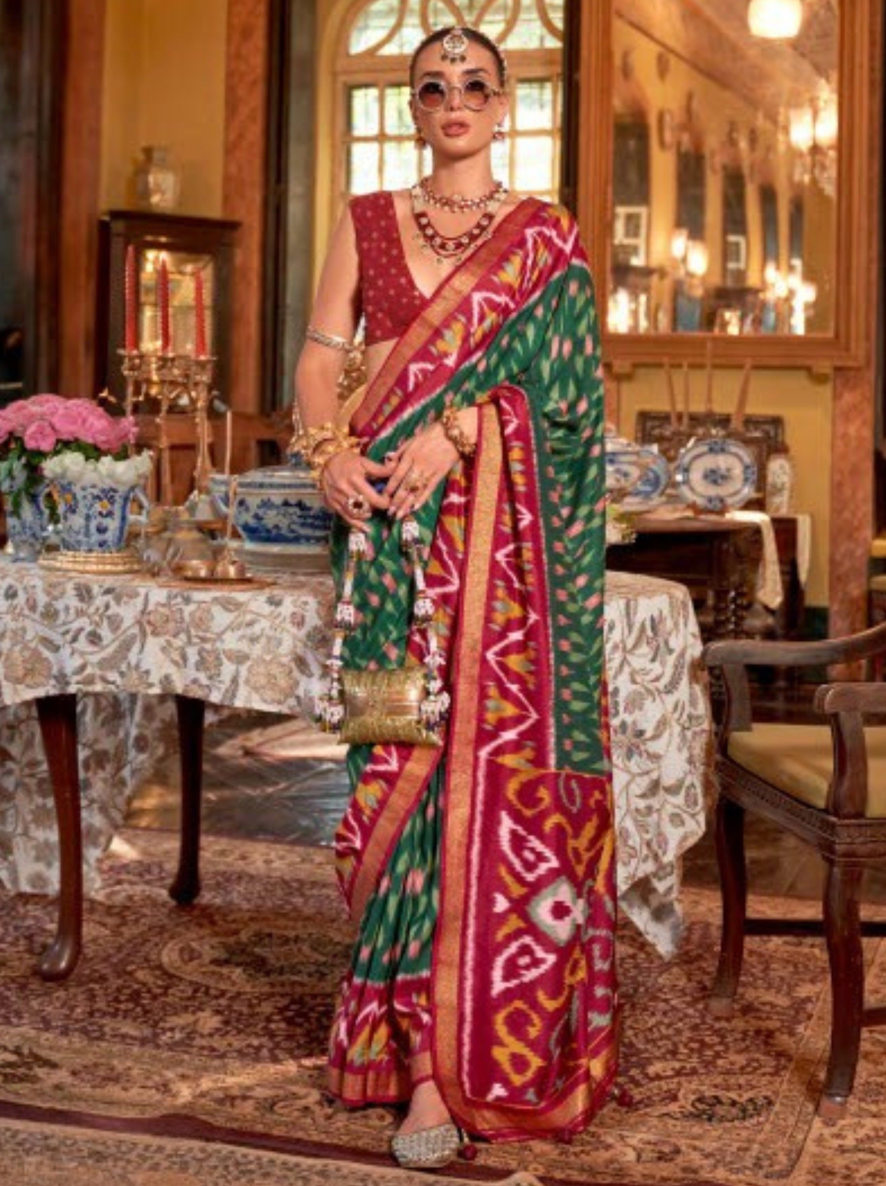 Sacramento Green Vibrant Patola Silk Festive Saree - TrendOye