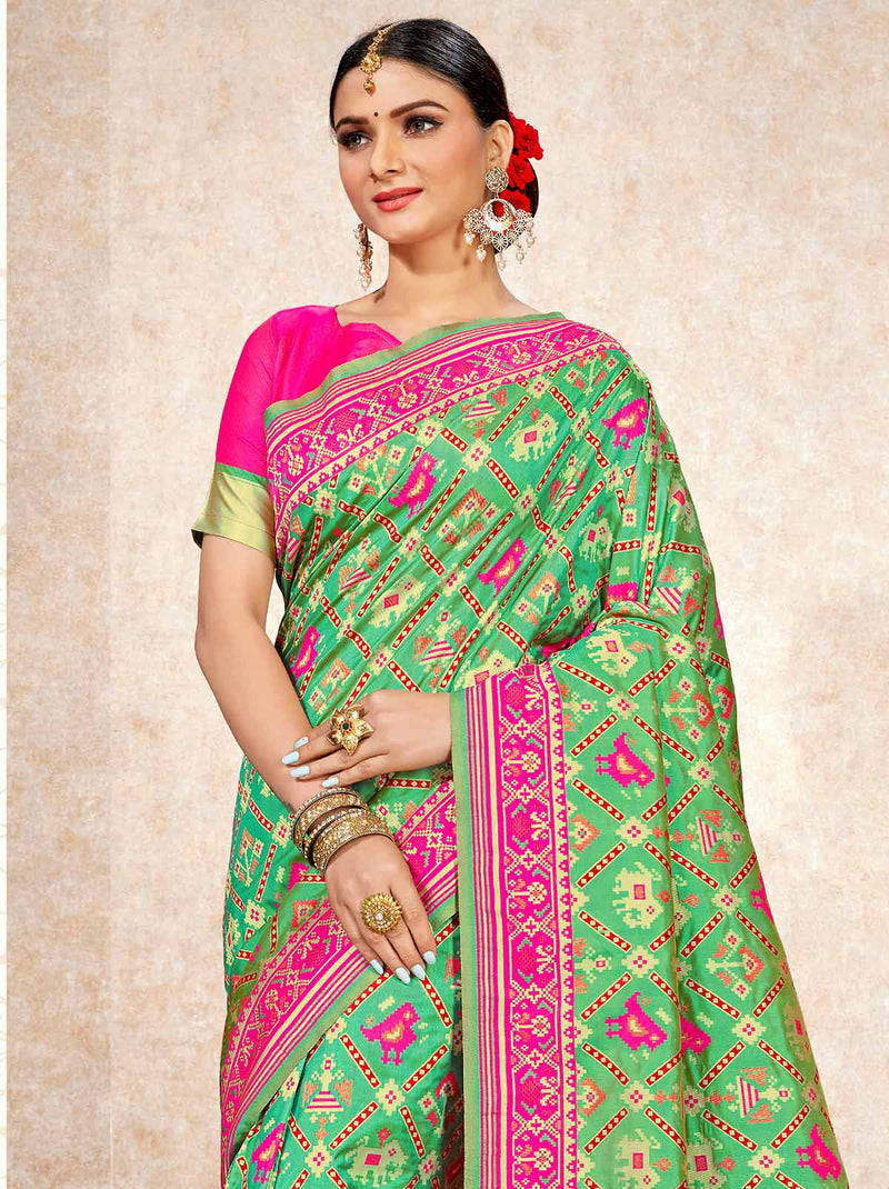 Vibrant and charming green patola saree - TrendOye